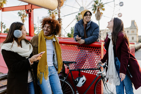 Young group of friends hanging out enjoying city break on winter vacation