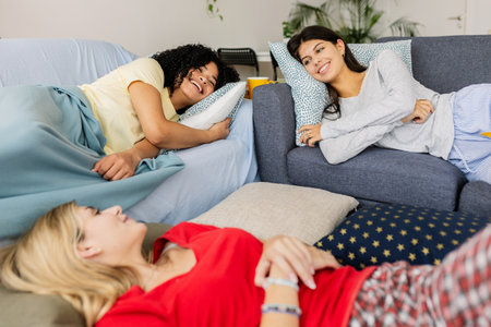 Three young girls relaxing after slumber party at home