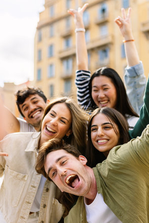 Young group of happy people enjoying time together at city streetの写真素材