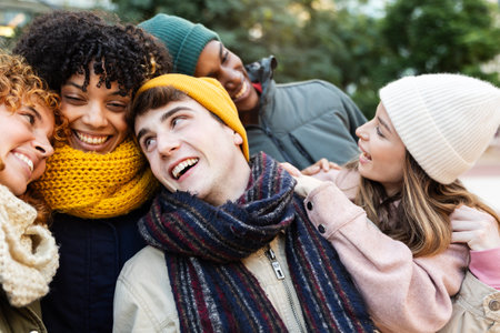 Group of young multiracial people having fun together in winter seasonの写真素材