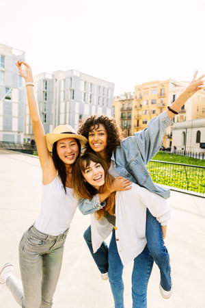 Young group of three multiracial women having fun enjoying summer vacationの写真素材