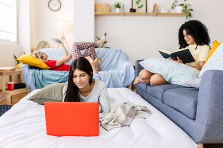 Young women relaxing at home during slumber partyの写真素材