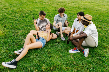 Diverse group of friends relaxing on grass