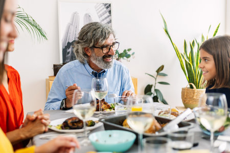 Family enjoying lunch together at homeの写真素材