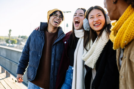 Multiracial tourist friends in winter clothes enjoying winter vacationの写真素材