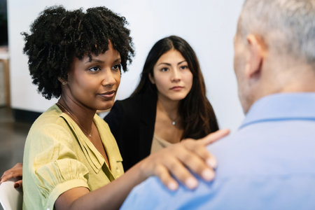 Diverse group of people in therapy session at community center