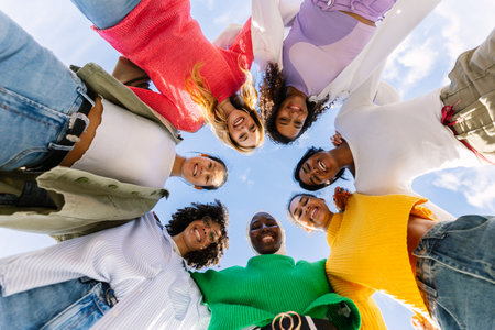Happy group of diverse young women forming circle outdoorsの写真素材