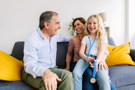 Granddaughter playing doctor with stethoscope with her family