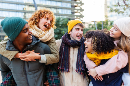 Young diverse gen z friends having fun together on winter vacationの写真素材