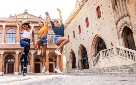 Three young happy women enjoying summer holidaysの写真素材