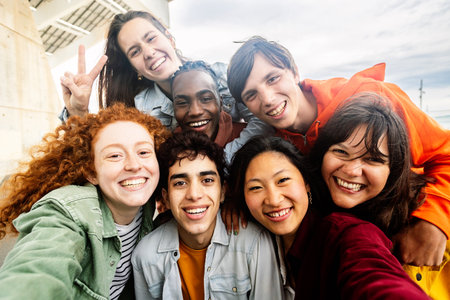 Multiracial young group of diverse friends standing together outsideの写真素材