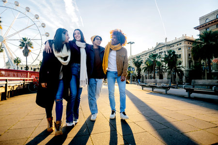 Diverse group of young friends having fun together outdoorsの写真素材