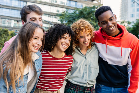 Multicultural group of friends having fun outdoors
