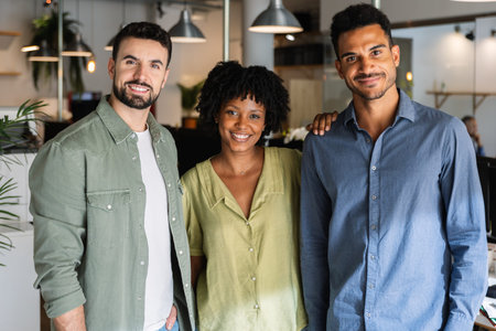 Confident diverse business team standing together in officeの写真素材