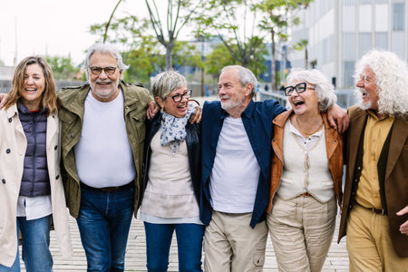 Group of elderly friends laughing and walking outdoors