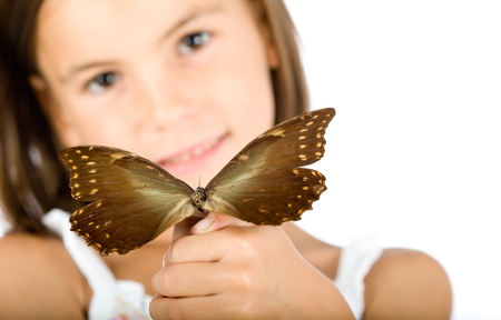 little girl holding a butterflyの写真素材