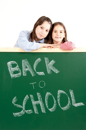 two girls with blackboard の写真素材