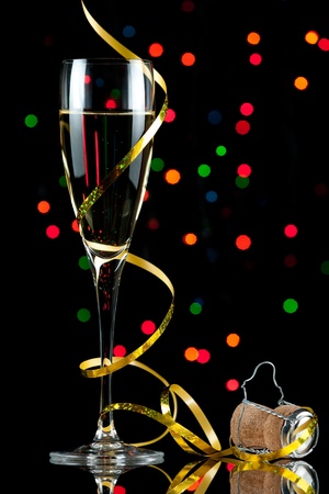 champagne flute with reflection and colored lights の写真素材