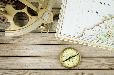 old map (1640 copyright expired) sextant and compass on wood backgroundの写真素材