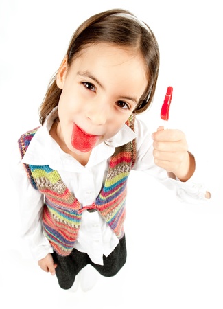 little girl with lollipop isolated on whiteの写真素材