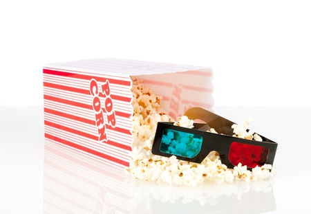 popcorn box with 3d movie glasses on a white backgroundの写真素材