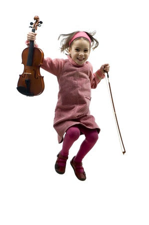 little girl with violin jumping isolated on whiteの写真素材