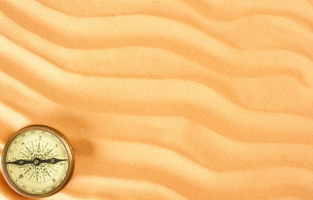 closeup sand background with compassの写真素材