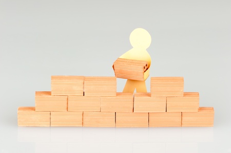 paper figure building a wallの写真素材