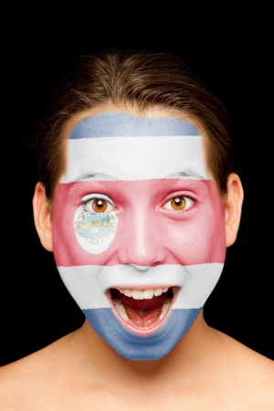 portrait of girl with Costa Rican flag painted on her faceの写真素材