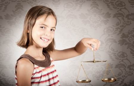 little girl holding justice scale little girl holding justice scale