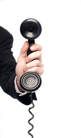 businessman hand holding retro telephoneの写真素材