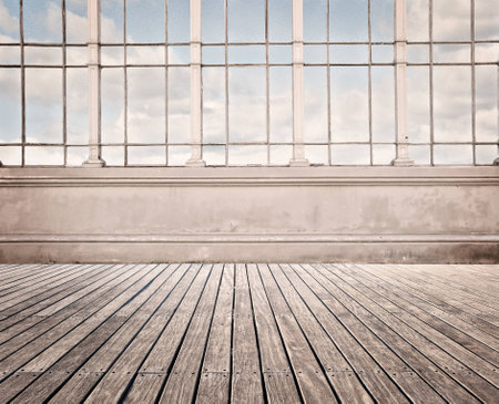 room with wide window and wood floorの写真素材