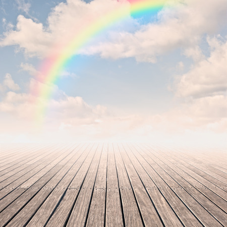 pier with rainbow on sunsetの写真素材