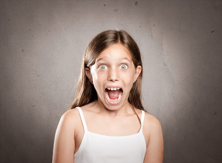 portrait of little girl with surprise expressionの写真素材