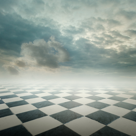 chequered floor landscape with cloudy skyの写真素材