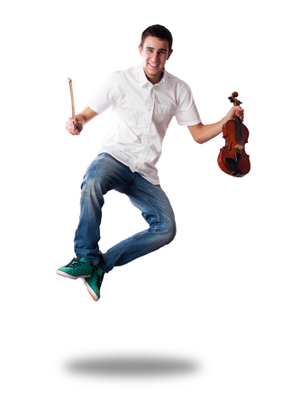 young man jumping with violin on white backgroundの写真素材
