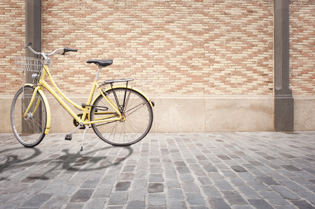 yellow bike in the streetの写真素材