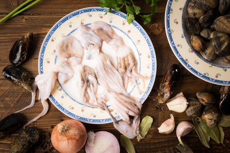 fresh octopusses on a wooden backgroundの写真素材