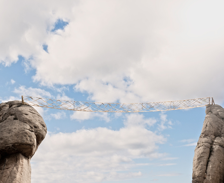 wooden bridge on a cloudy skyの写真素材