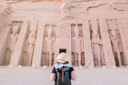back view of woman standing in front of Abu Simbel temple in Aswan Egyptの写真素材