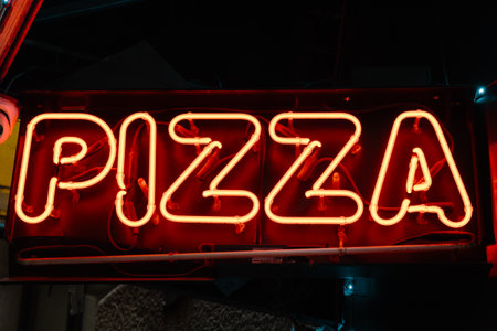 neon sign with pizza wordの写真素材