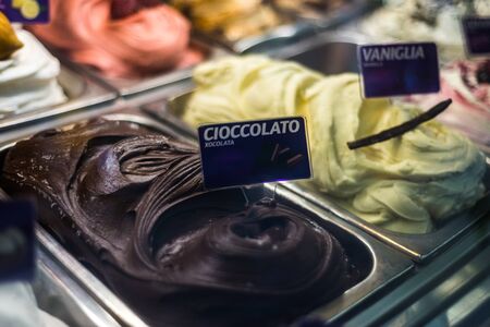 Chocolate ice cream Rows of ice-cream through a shop windowの写真素材