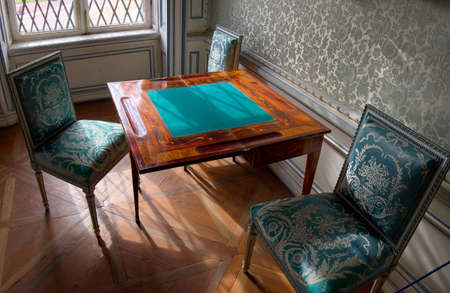 A place in the house for a card game, with a card table and chairs of the XVIII century, Spainの写真素材