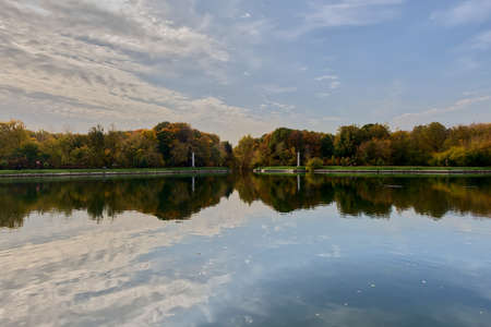 Sunrise beautifully illuminates the distant Rostral columns on the lake shoreの写真素材