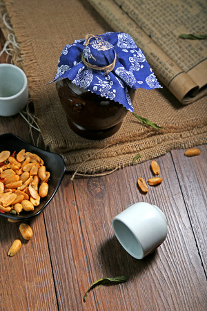 Ceramic bottle glass book placed on a wooden table
