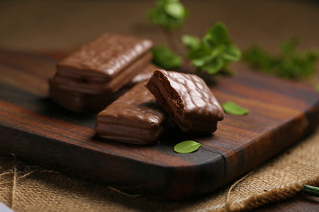 Chocolate wafer cookies on brown woodの写真素材