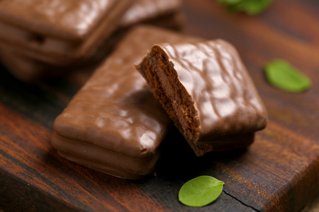 Chocolate wafer cookies on brown woodの写真素材