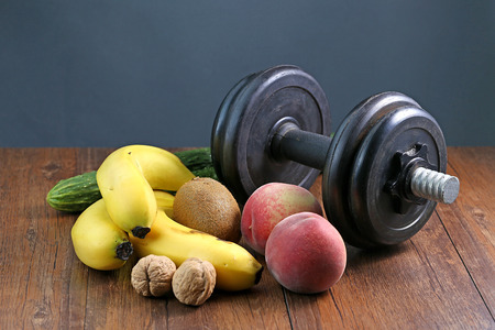 Healthy lifestyle dumbbell exercise and fruitの写真素材