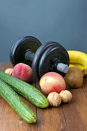 Healthy lifestyle dumbbell exercise and fruitの写真素材