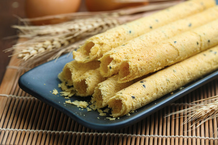 egg rolls on black plate